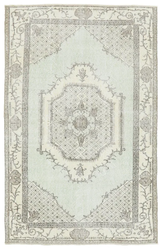 Full overhead view of the Faded Green Medallion Rug on a white background