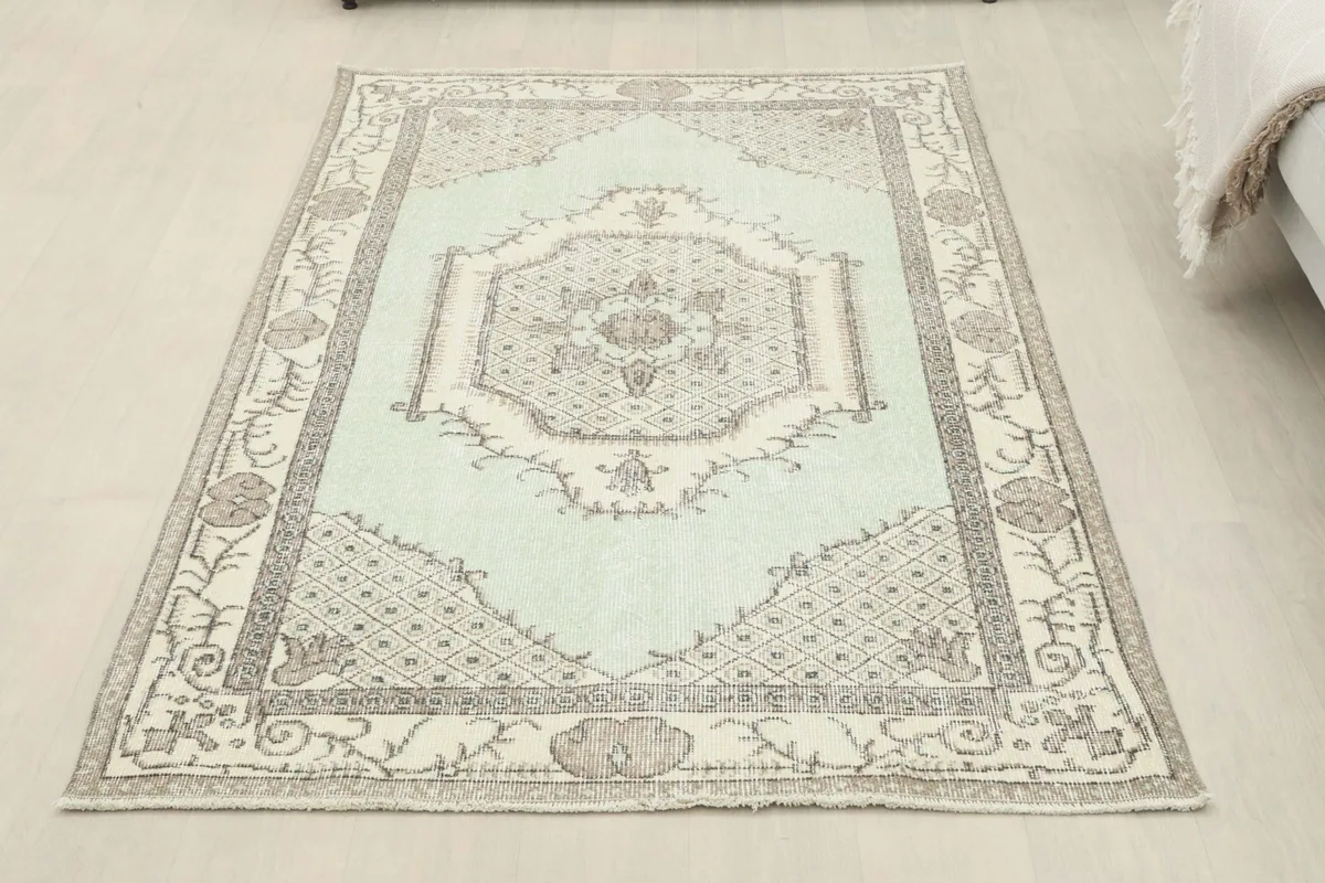 Overhead view of the rug laid flat in a room, offering a full perspective of its design