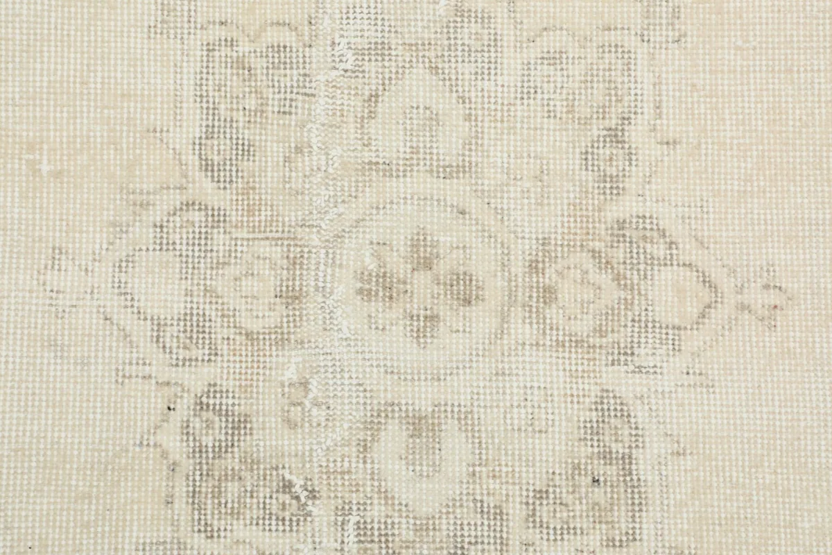 Detailed view of the low wool pile and intricate hand-knotted weave