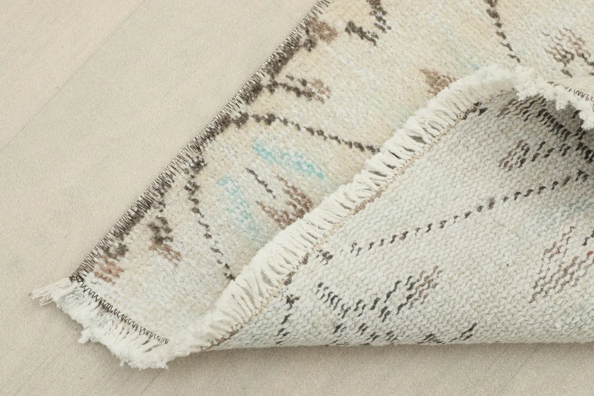 View of the back of the runner, revealing the hand-knotted construction and cotton foundation.