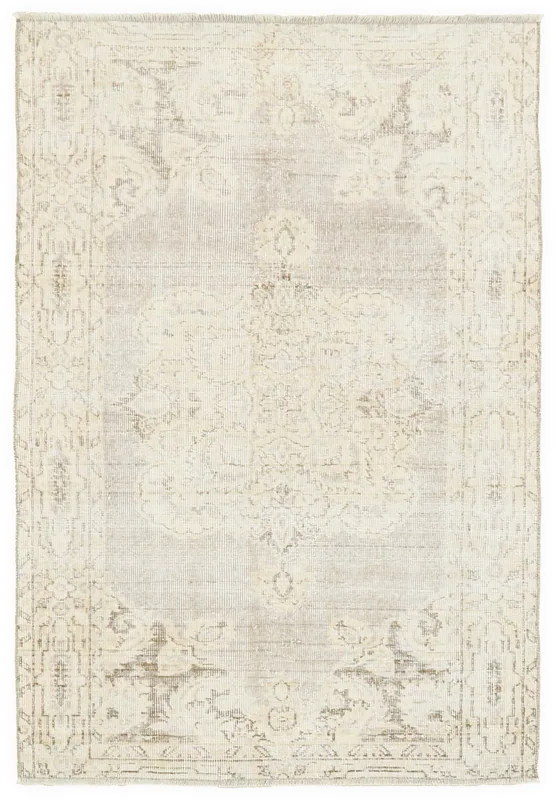 Full overhead view of the beige and gray vintage Anatolian area rug with a faded medallion design