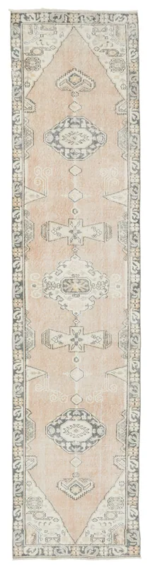 Full top view of the 2'9" x 12'7" rose tribal medallion runner rug on a white background.