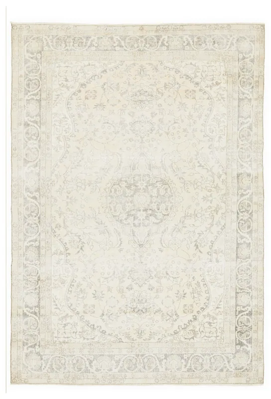 Full top view of the ivory and gray vintage Anatolian area rug on a white background