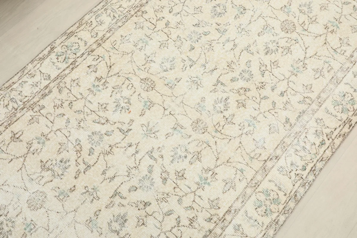 Overhead view of the rug's central design, emphasizing the overall floral motif