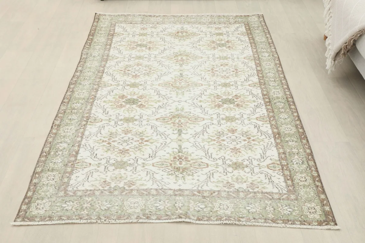 Full room view of the small area rug from a slightly elevated perspective