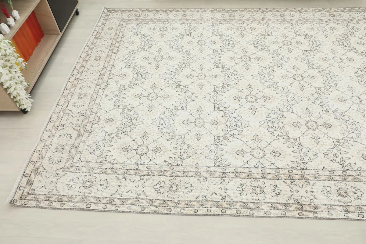 Angled shot of the rug in a room, emphasizing its size and overall pattern.