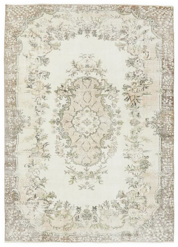 Full top view of the 6'3" x 9'3" ivory and beige vintage Anatolian area rug with floral medallion.