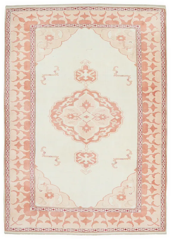 Full overhead view of the ivory and rose medallion vintage Anatolian area rug