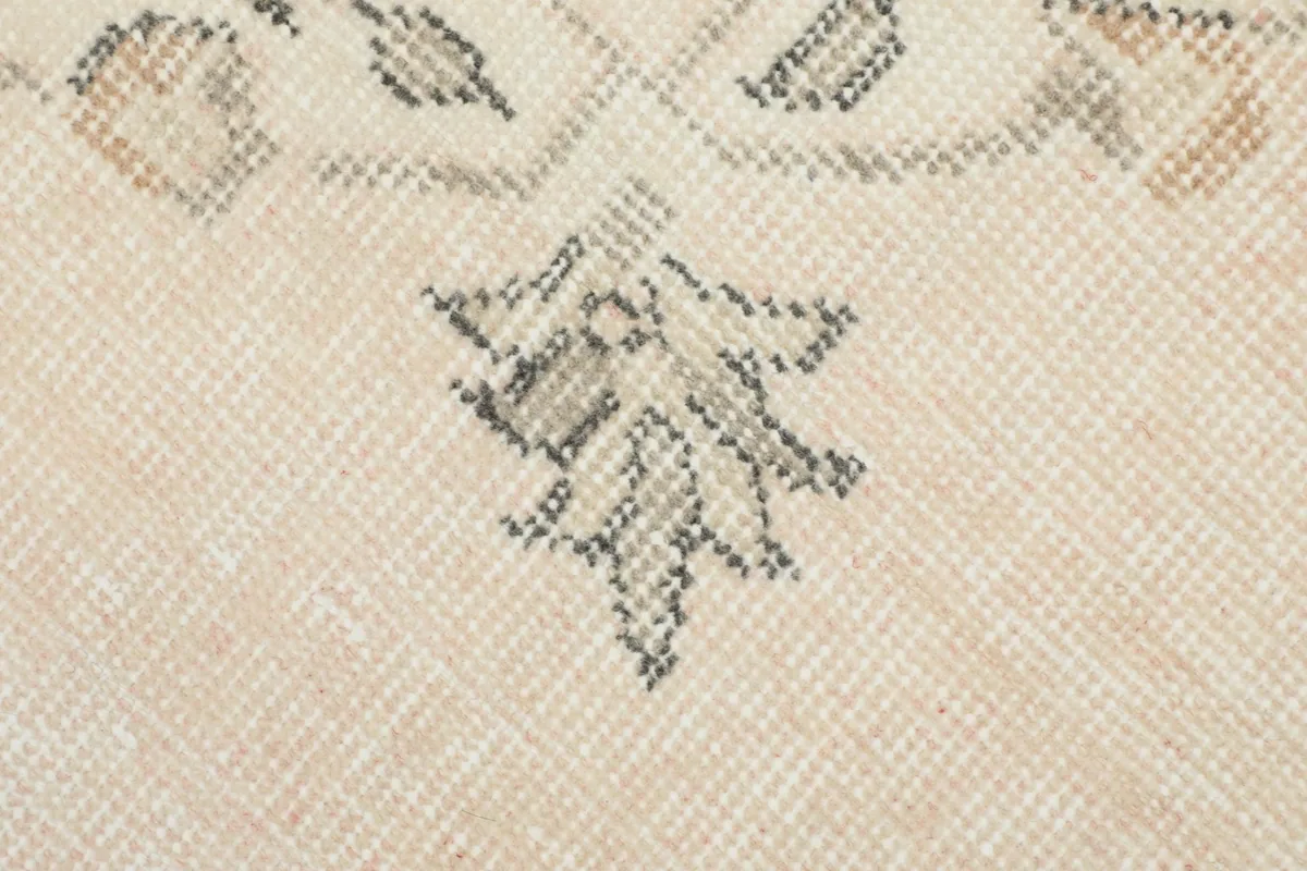 Macro detail of the hand-knotted wool pile and weave texture of the rug