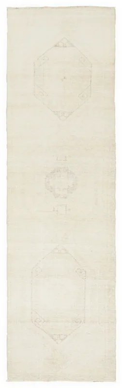 Full top view of the 3'0" x 10'8" ivory geometric Anatolian runner rug on a white background.