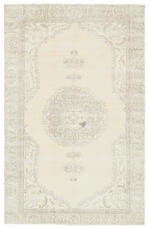 Full overhead view of the 6'7" x 10'4" ivory and gray vintage Anatolian rug with central medallion