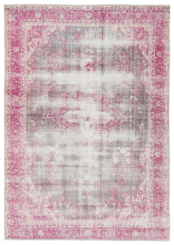 Top view of 6'4" x 9'3" vintage Anatolian rug with pink border and faded gray field