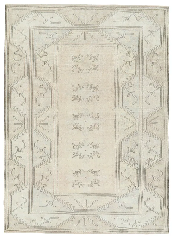 Full overhead view of the 6'7" x 9'3" beige and gray vintage Anatolian rug on a white background.