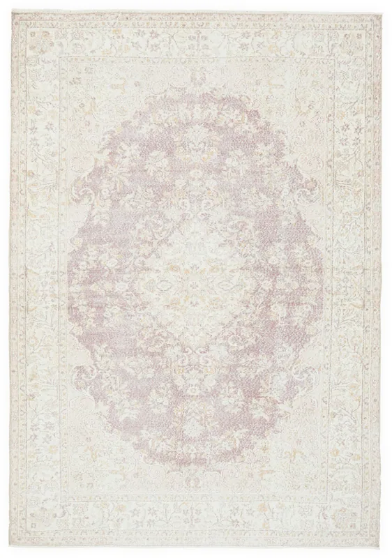 Full overhead view of the 7'1" x 10'7" vintage Anatolian rug with rose medallion on an ivory field