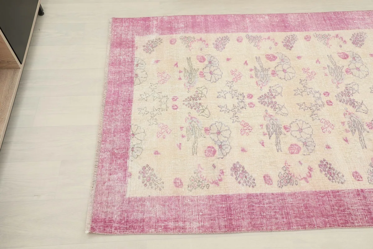 Another angle shot of the rug, detailing the border texture and field patterns
