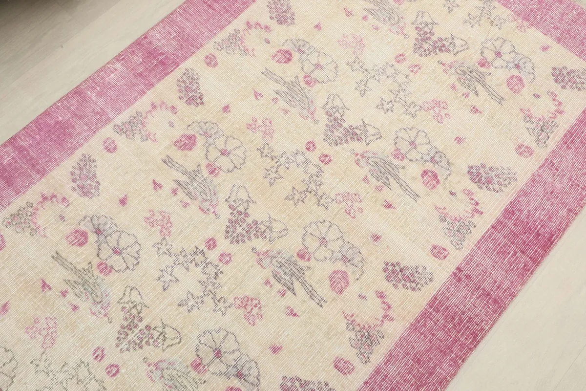 Overhead view of the rug's center, showcasing the floral and geometric patterns
