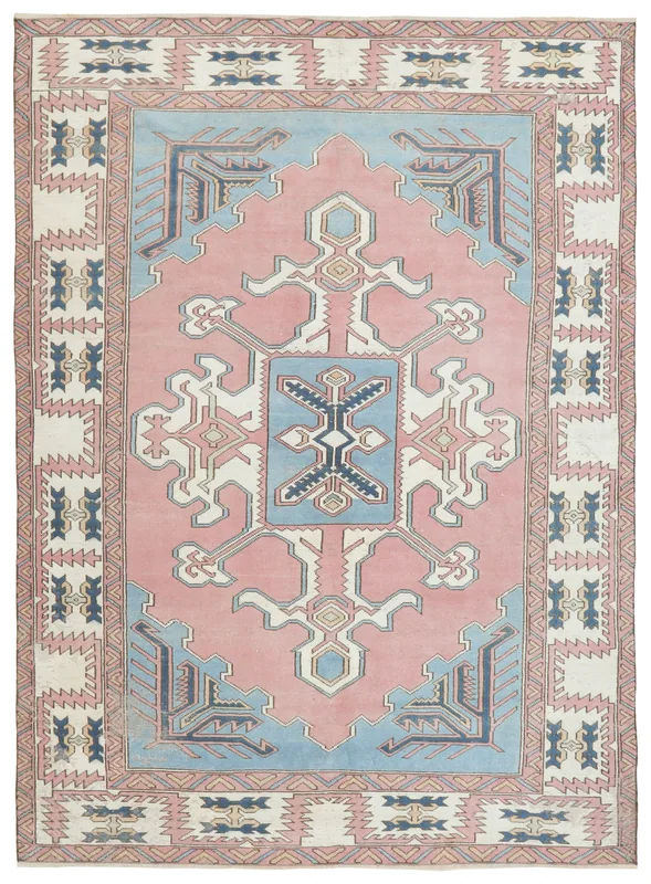 Full overhead view of the pink and blue vintage Anatolian area rug