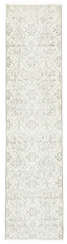 Full top view of the 2x11 ivory and gray geometric Anatolian runner on a white background