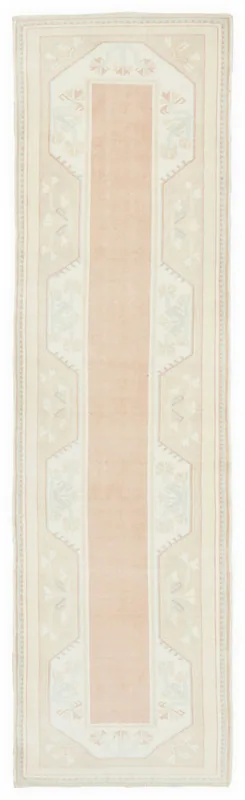 Full overhead view of the 2'6" x 9'7" vintage Anatolian runner with a rose center.