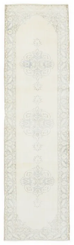 Full overhead view of the 3x12 ivory and blue vintage runner rug on a white background.