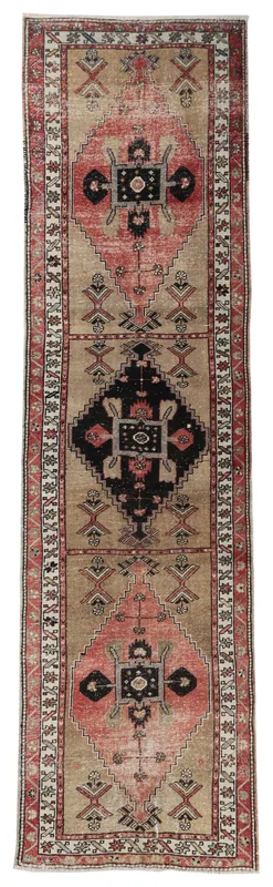 Full top view of the 3'4" x 12'5" vintage Anatolian runner rug with tan, red, and charcoal geometric patterns.