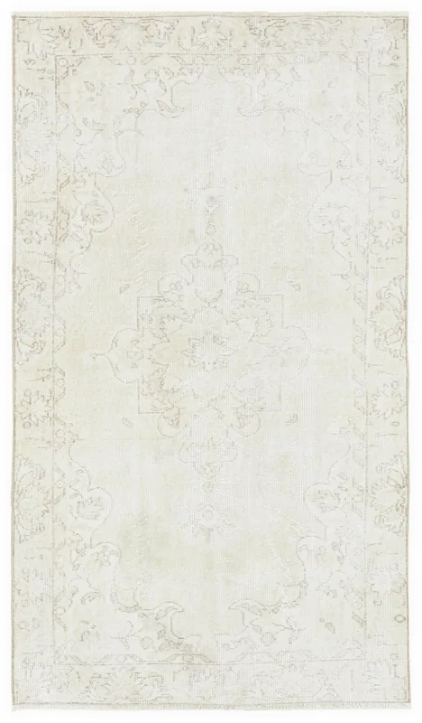 Full top view of the 4x7 ivory beige vintage Anatolian wool rug on a white background.