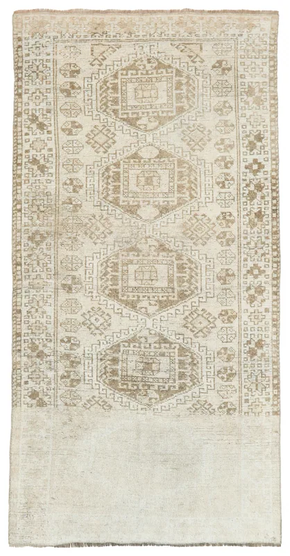 Full top view of the 4x8 vintage Anatolian rug with beige and tan geometric patterns
