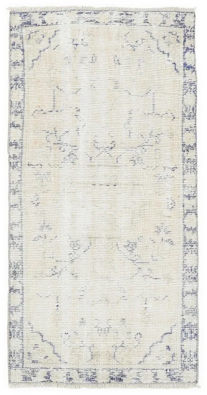 Full overhead view of the 2'2" x 4'6" ivory and navy vintage Anatolian rug on a white background.