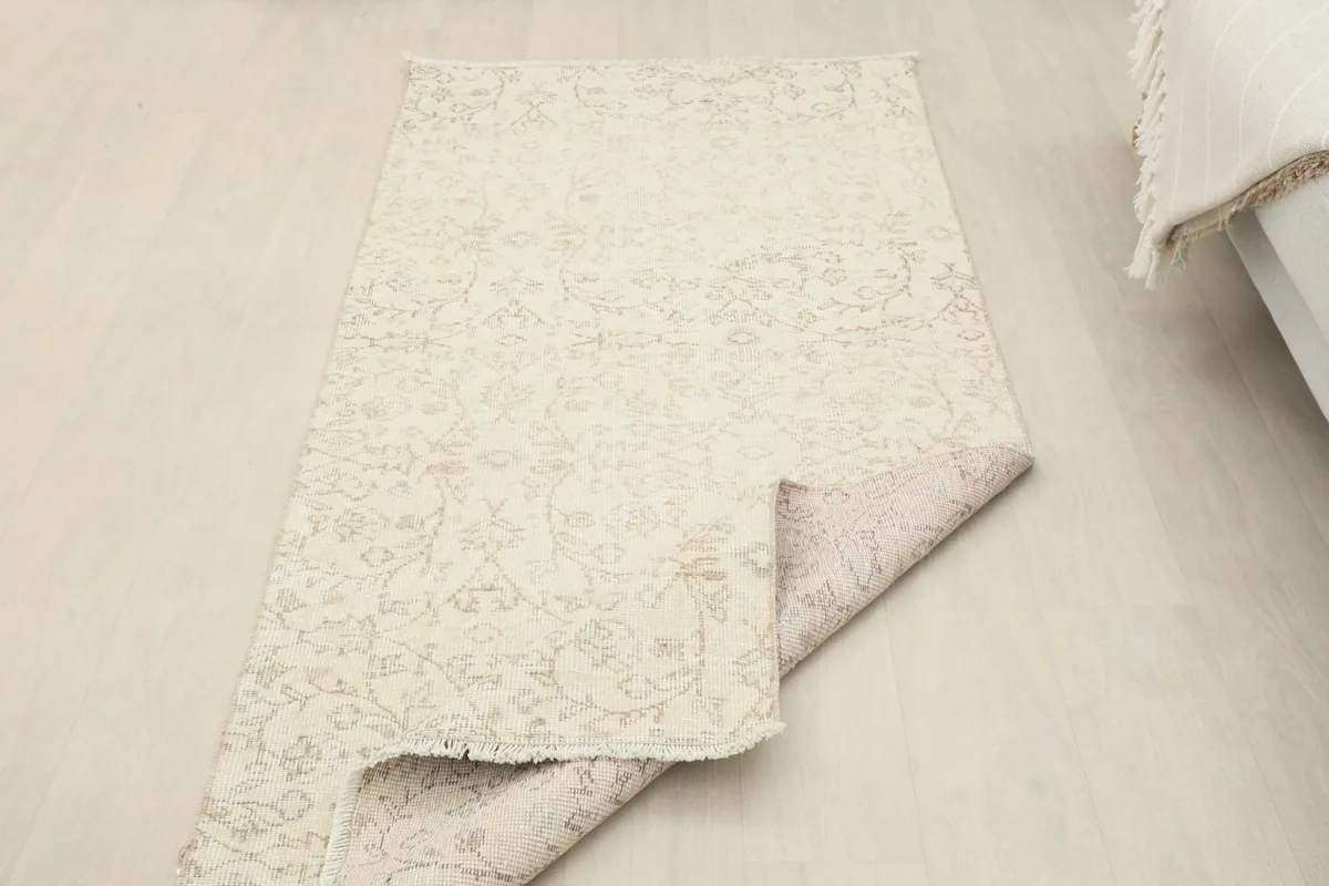 View of the rug's back, revealing the hand-knotted construction and cotton foundation