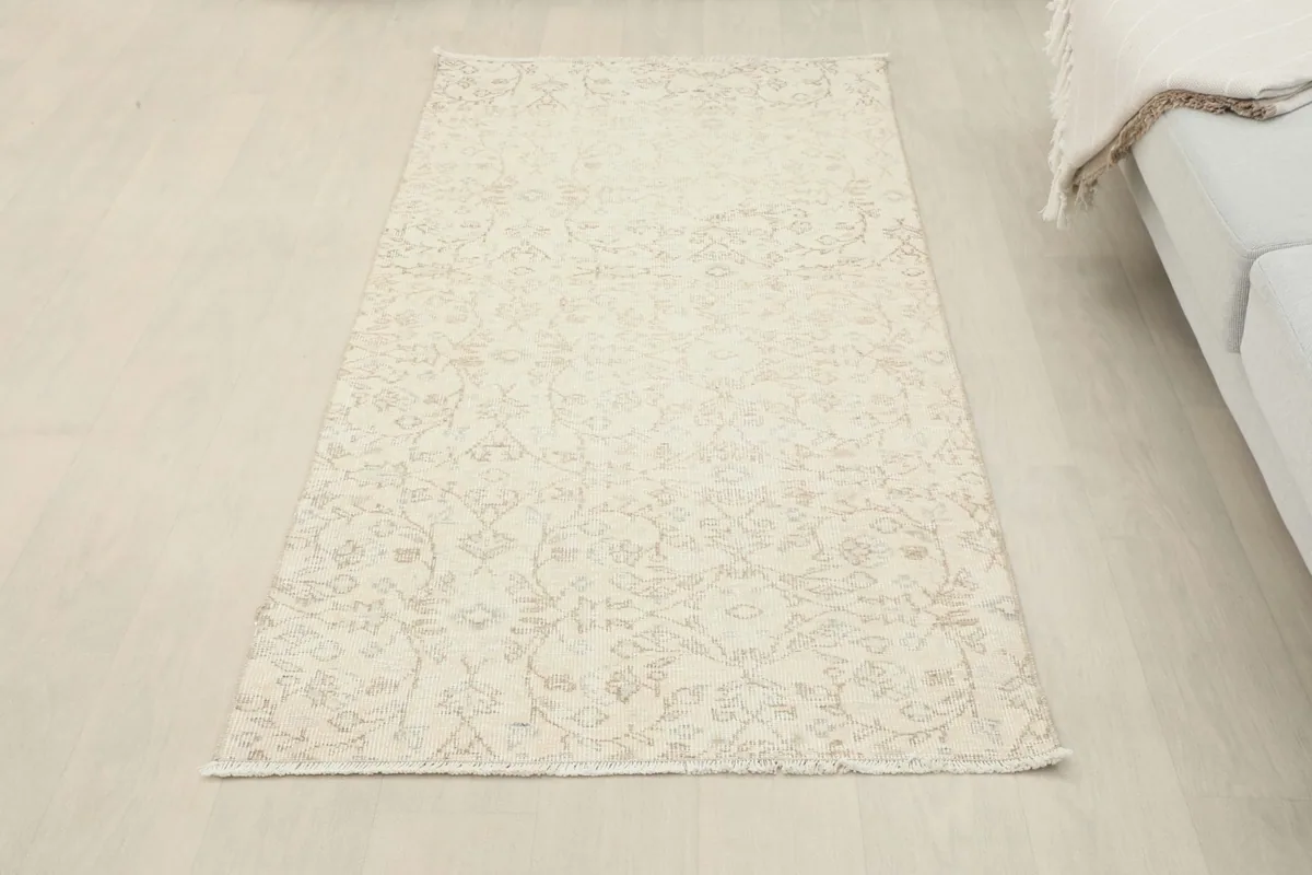 Overhead view of the vintage cream runner, showing its rectangular shape and overall design