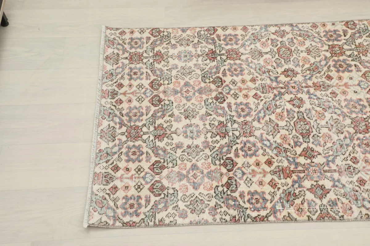 Close overhead view of a section of the runner, highlighting the intricate floral and geometric patterns