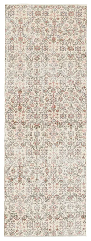 Full overhead view of the vintage Anatolian runner rug with ivory, rose, blue, and gray geometric patterns.