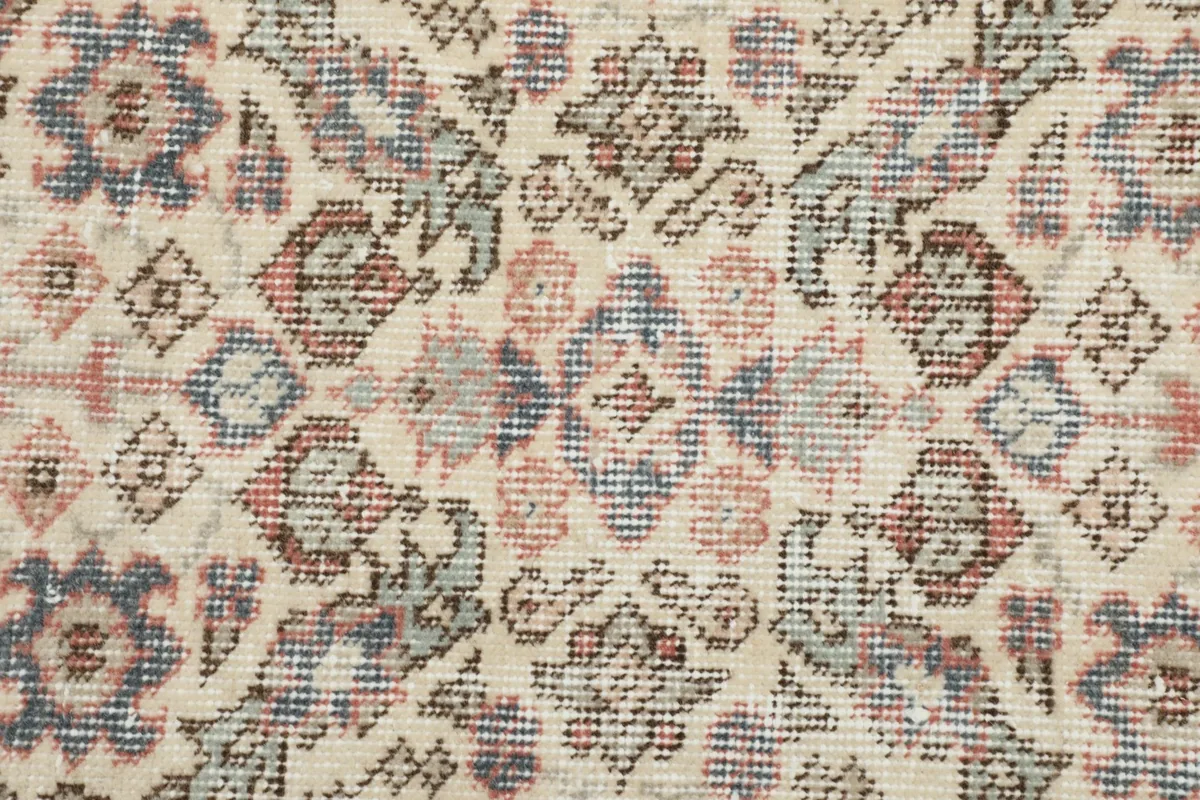 Detailed close-up of the hand-knotted wool pile and intricate geometric design.
