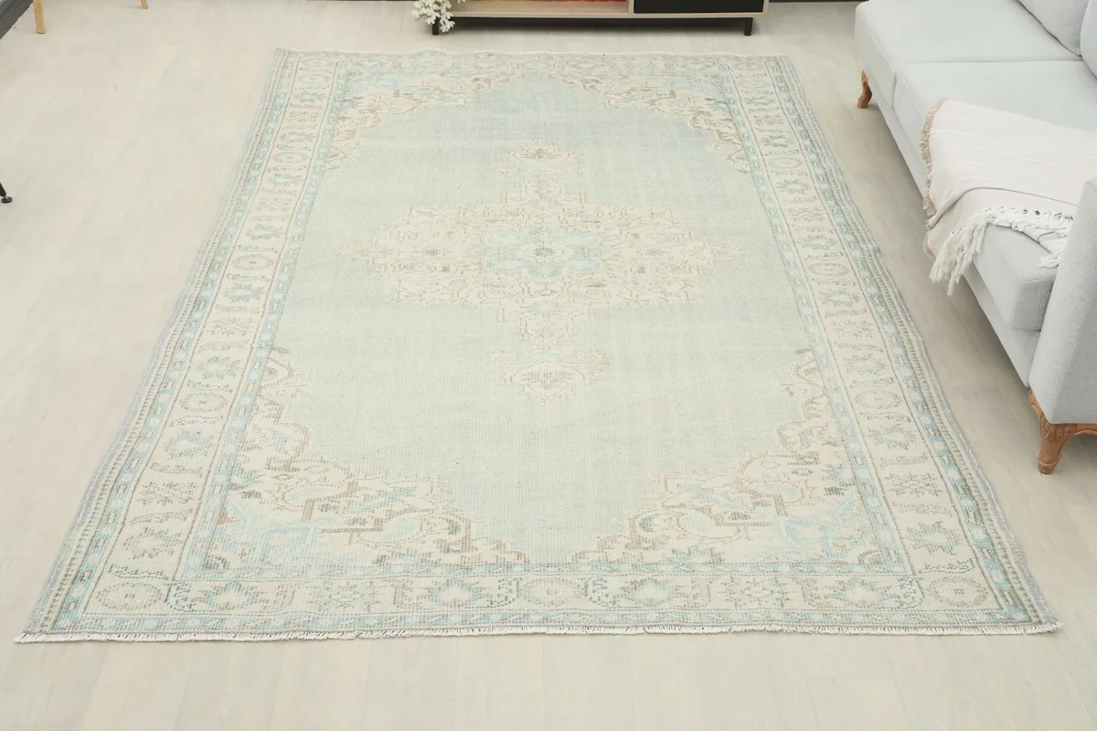 Overhead view of the entire rug in a room setting, displaying its full design and scale
