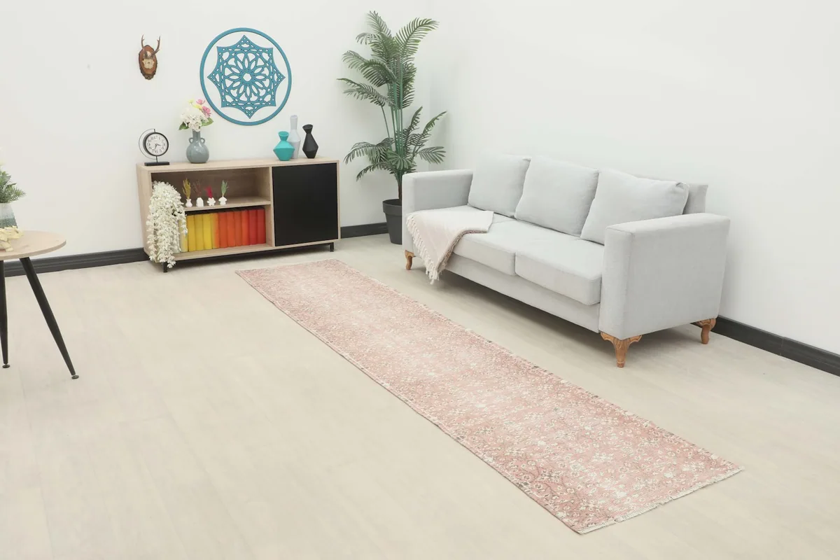 Vintage runner rug in a modern living room setting, showcasing its length and color
