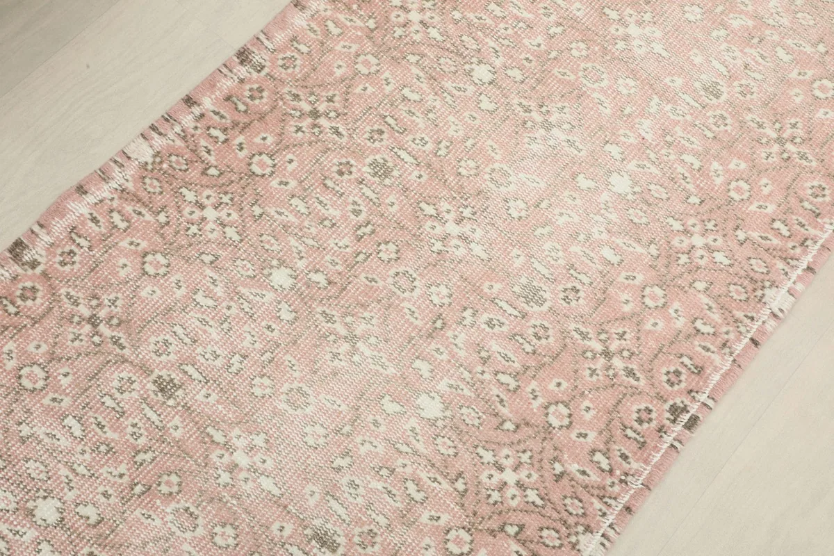 Overhead perspective of the runner's central design, revealing the intricate patterns and patina