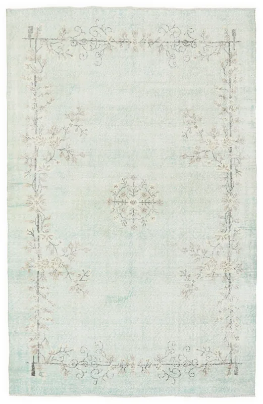 Full overhead view of the 6'5" x 10'5" vintage Anatolian rug with a soft blue field and floral border.