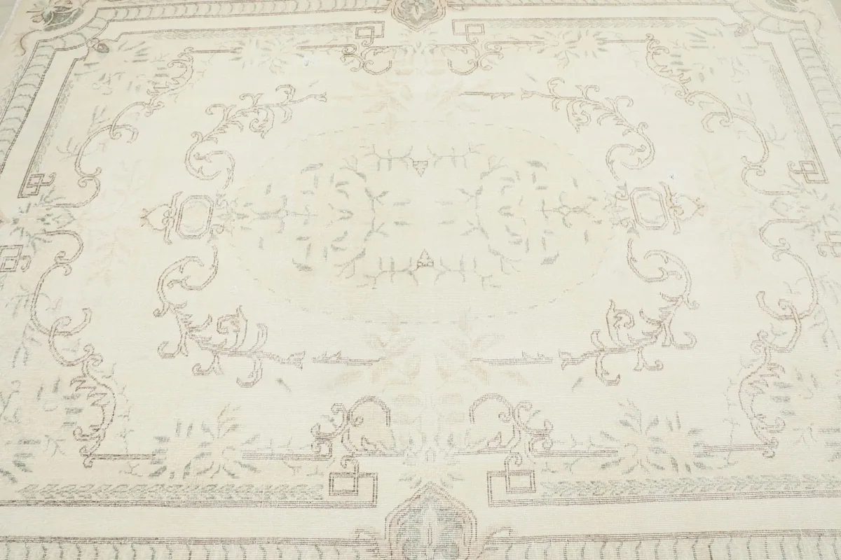 Close overhead view of the rug's central medallion and surrounding floral motifs