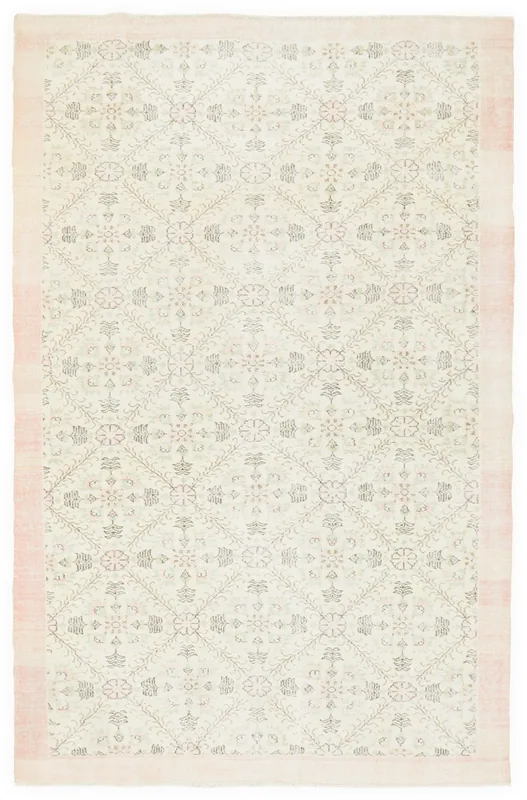 Full overhead view of the 6'2" x 9'9" ivory and rose floral geometric vintage Anatolian area rug