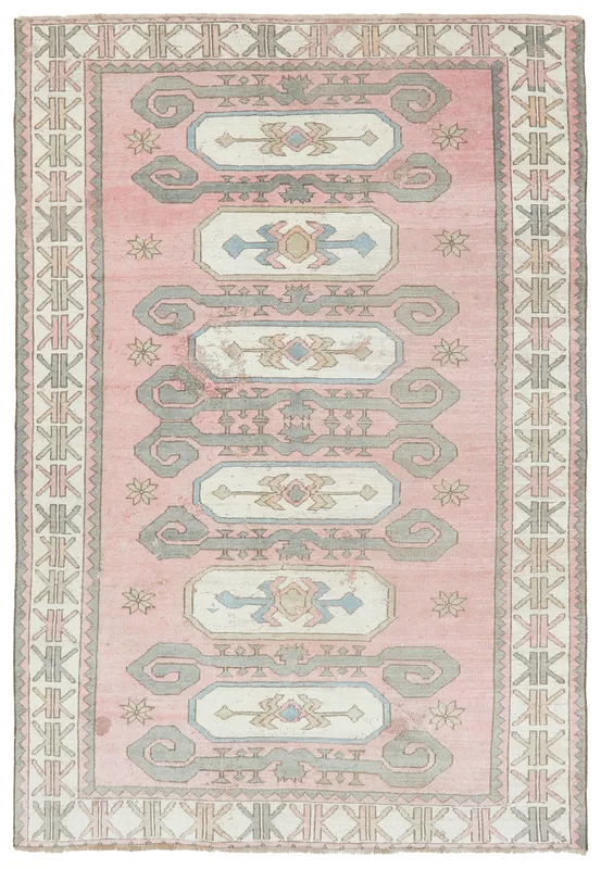Full overhead view of the rose tribal medallion Anatolian rug with geometric patterns.