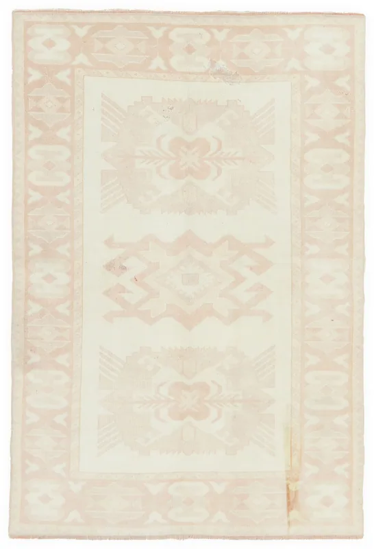 Full overhead view of the 4'9" x 6'11" cream and rose vintage Anatolian rug on a white background.