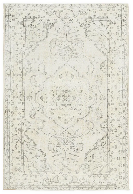 Full overhead view of the ivory and gray vintage Anatolian rug on a white background