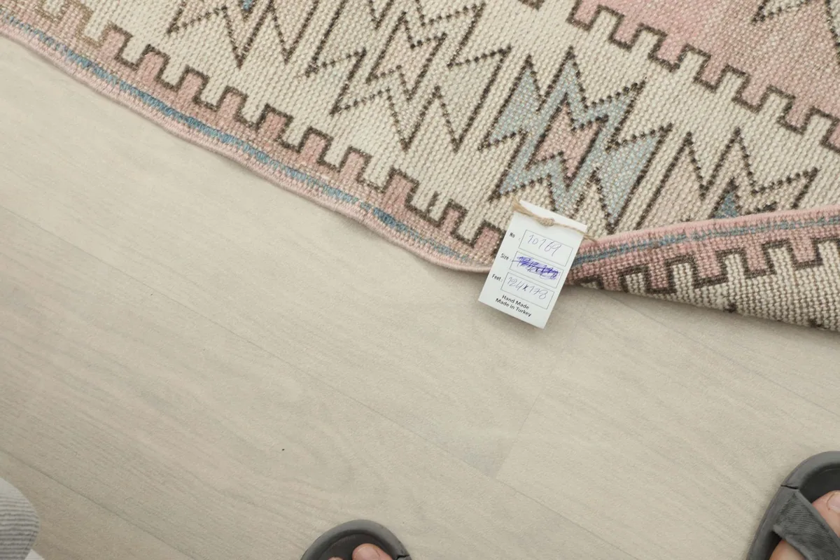 Close-up of the rug's back, revealing the intricate hand-knotting and cotton foundation