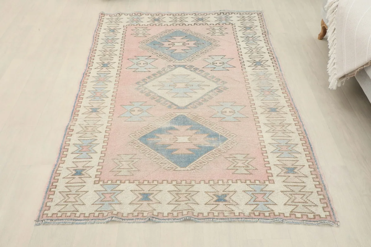 Full overhead view of the vintage Anatolian rug from a slightly elevated perspective in a room