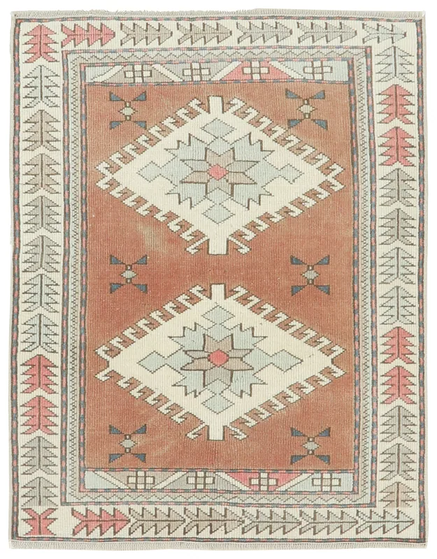 Full overhead view of a 3x4 rust geometric Anatolian vintage wool rug on a white background
