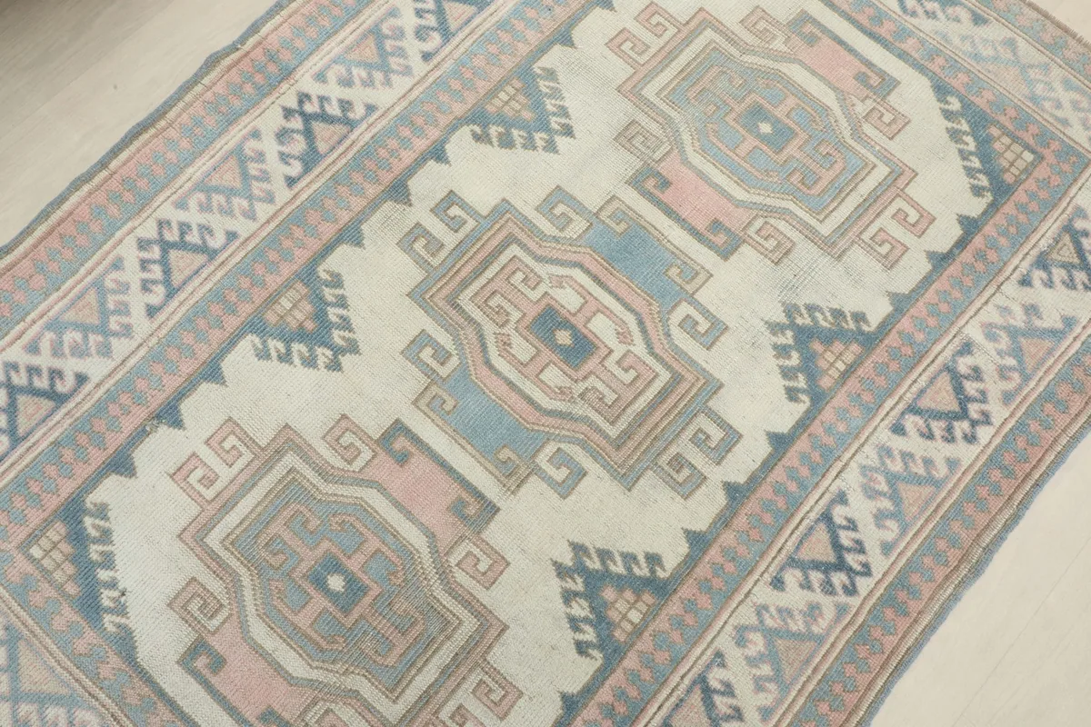 Overhead view from an angle, focusing on the main field and the distinct medallion patterns.