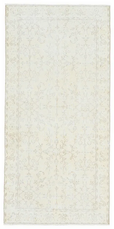 Full overhead view of a 3x6 soft ivory and beige floral hand-knotted vintage area rug on a white background.