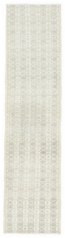 Full overhead view of the hand-knotted vintage cream and gray geometric runner rug