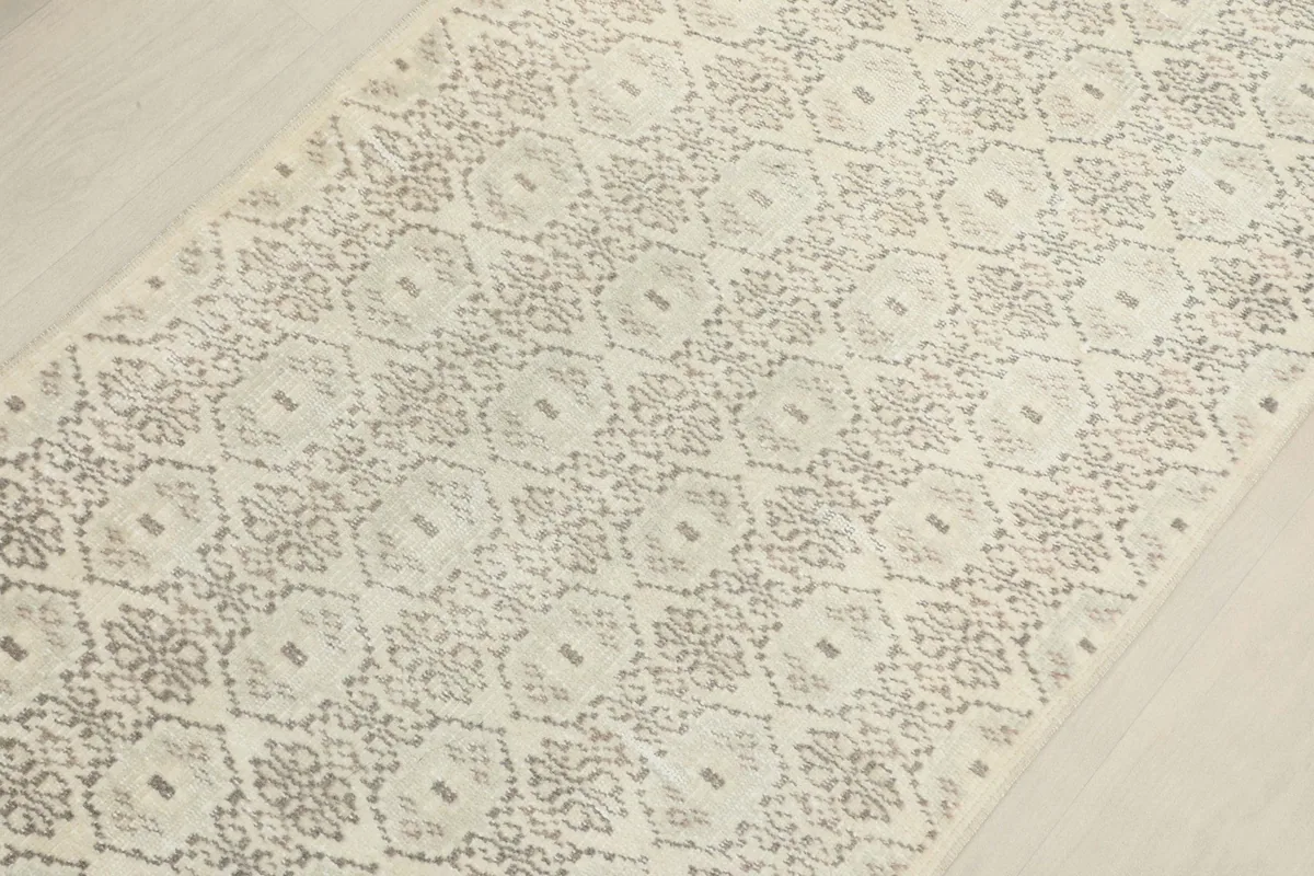 Detailed overhead view capturing the intricate hand-knotted geometric design of the runner