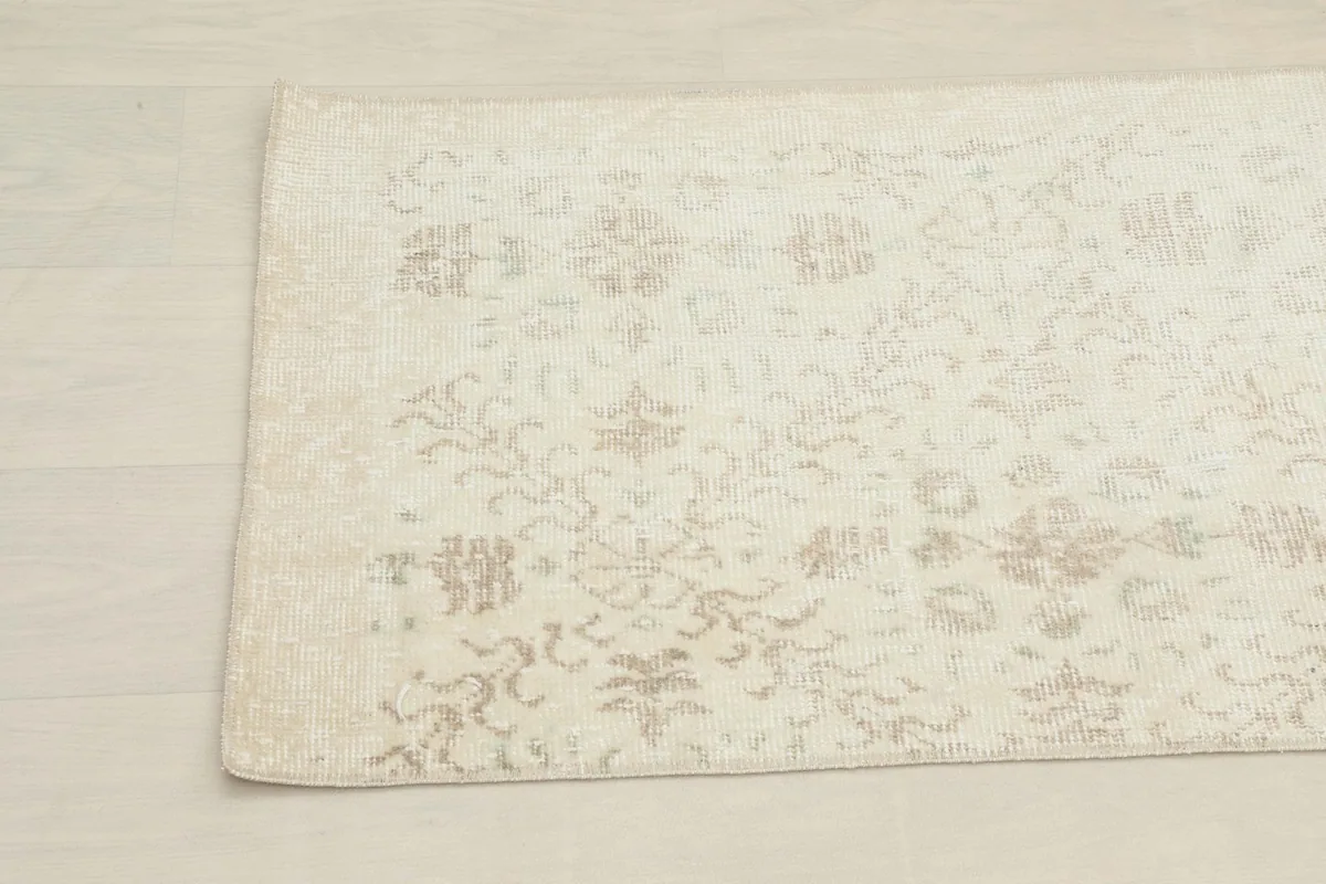 Close-up of the other end of the vintage runner, showing the subtle color variations and hand-knotted texture.
